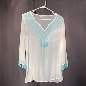Delicate white tunic with light blue embroidery
